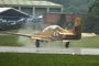 Short Tucano touches down in the rain